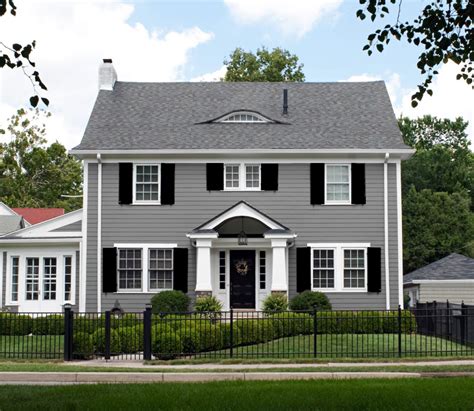 dark gray house with shutters.